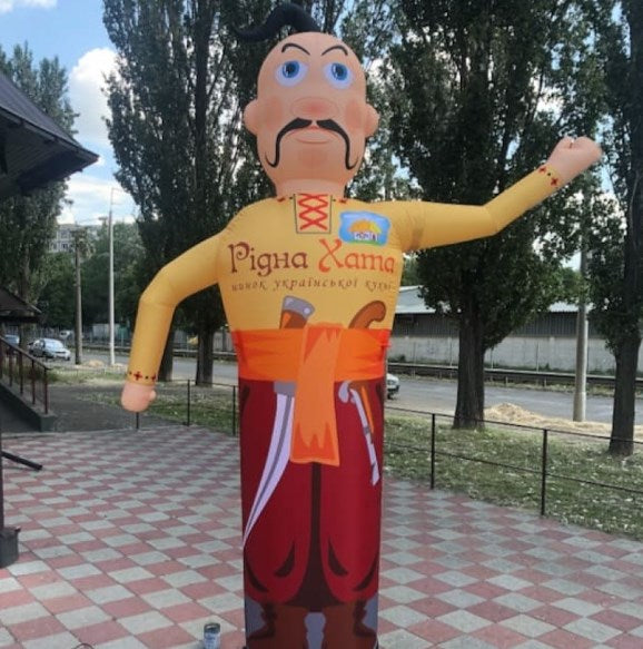 Inflatable character waving hand, Cossack 340 cm with fan for outdoor advertising of a Ukrainian cuisine restaurant