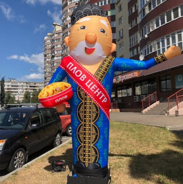Inflatable waving man 340 cm for street advertising of an Uzbek restaurant