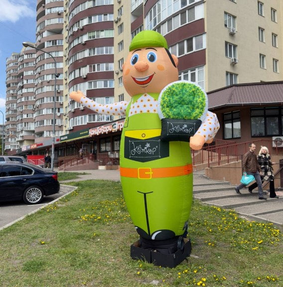 Inflatable man for gardening shop height 340 cm with waving hand