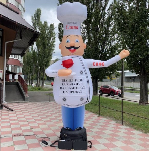 Inflatable character waving hand, Chef with a glass 340 cm with fan for outdoor advertising of a restaurant or gastrobar